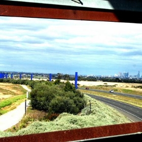 Melbourne City skyline from Whittlesea Gardens Footbridge over the Hume Freeway - Takver Melbourne City skyline from Whittlesea Gardens Footbridge over the Hume Freeway - Takver