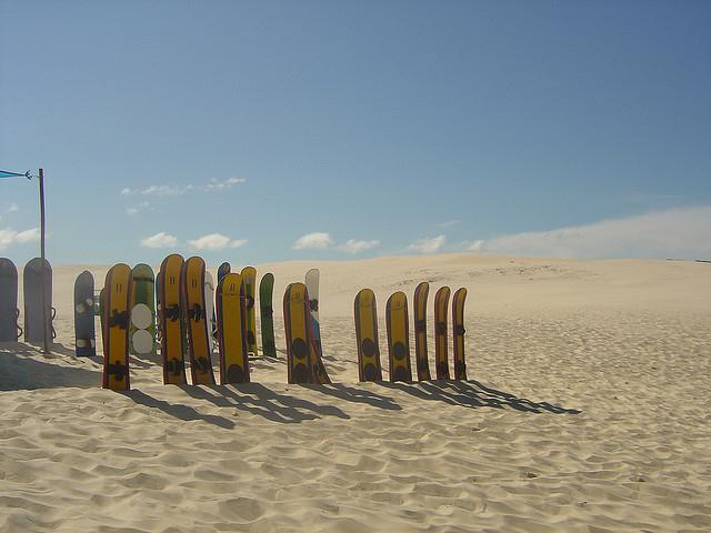 Mike Vondran sandboarding at Praia Juaquina, Florianopolis, Brazil, December 20 2008.